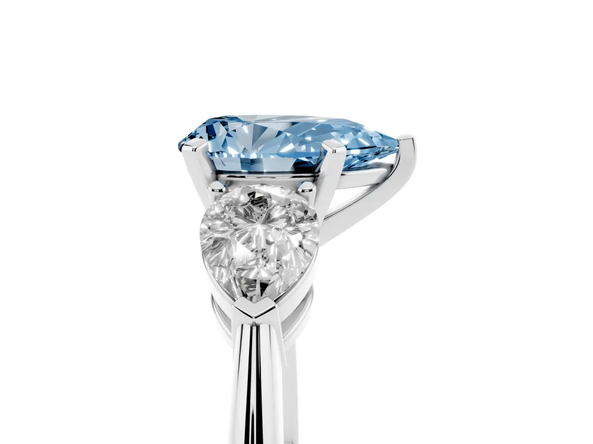 Fancy Blue Three-Stone Pear Cut Diamond Ring with Pear Side Stones and Four-Prong Setting Silver