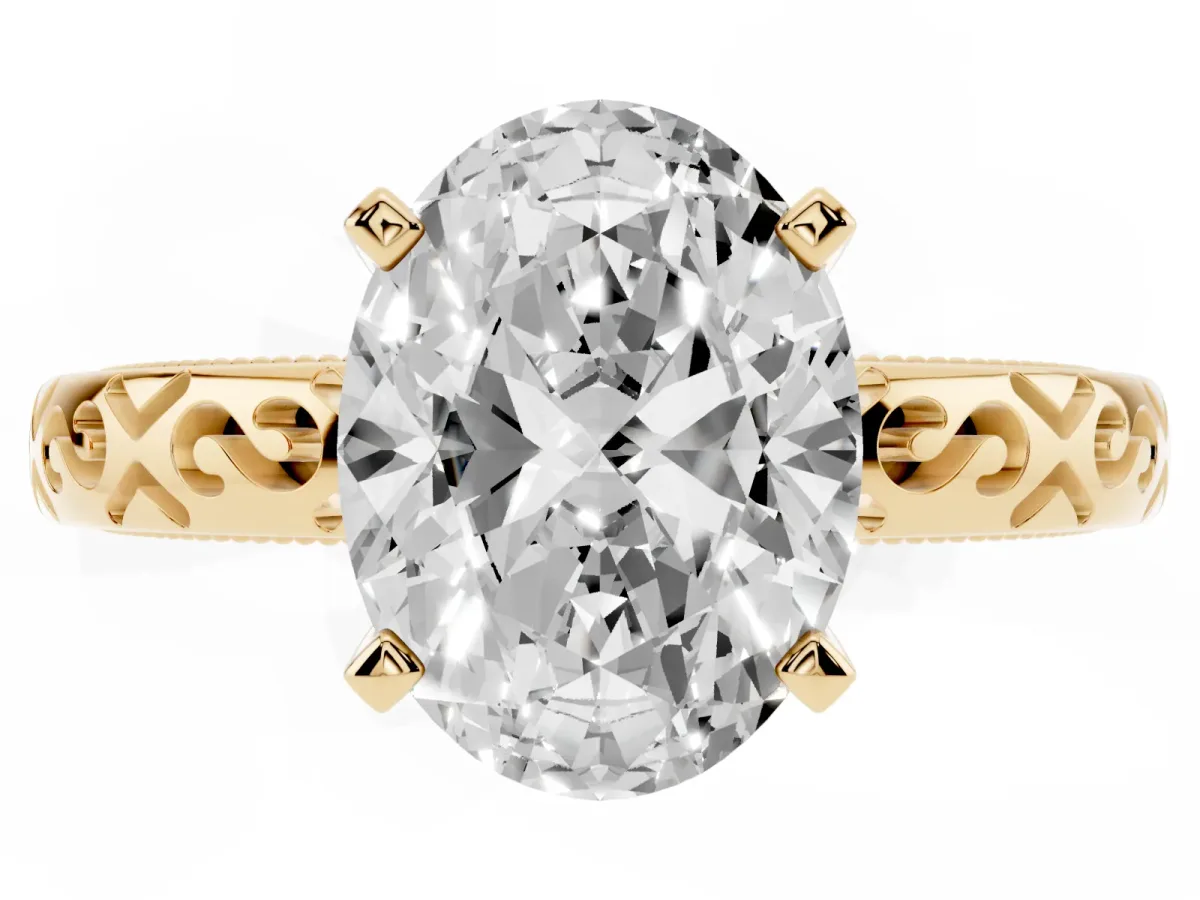 Oval Cut Solitaire Engagement Ring with Scrollwork Band and Four-Prong Setting Yellow gold