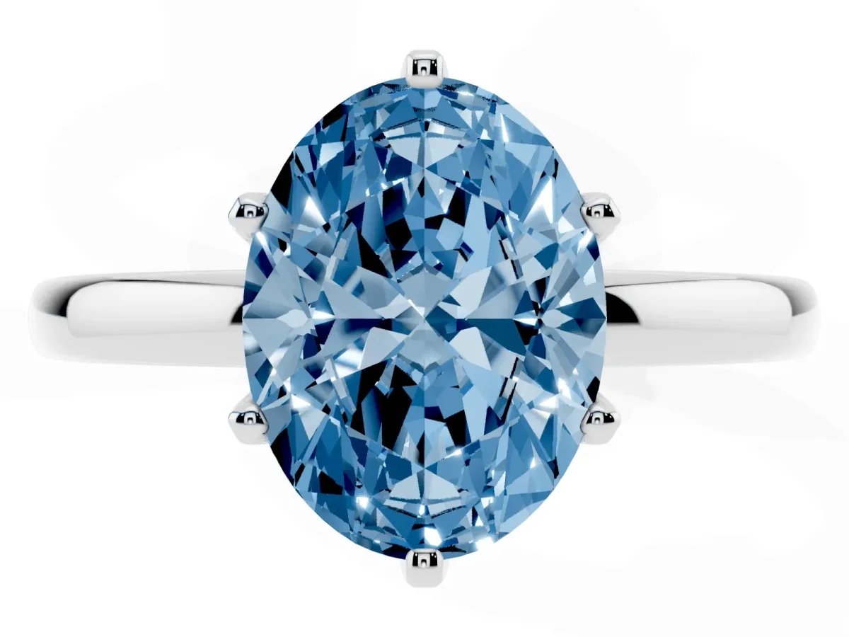 Fancy Blue Oval Cut Solitaire Diamond Ring with Six-Prong Setting on a Classic Band Silver