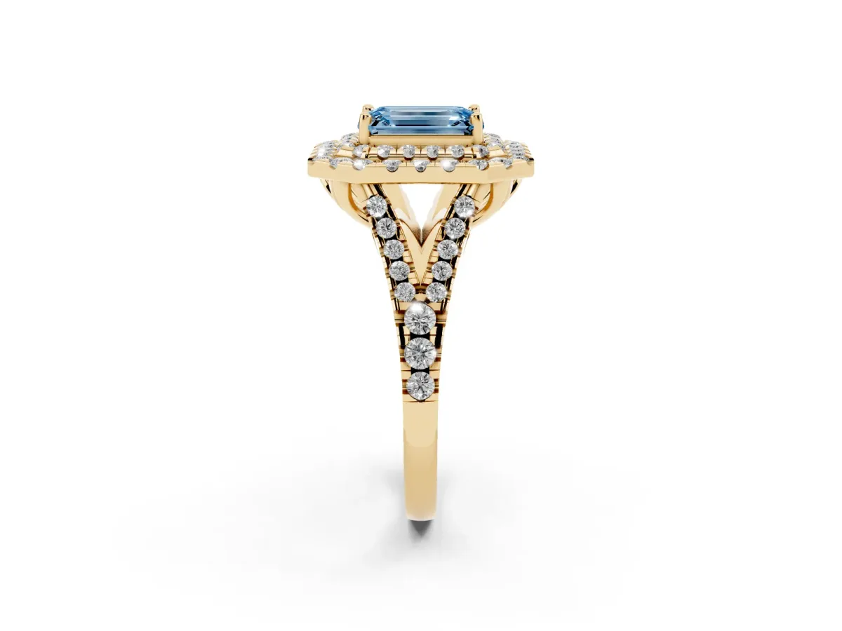 Fancy Blue Double Halo Emerald Cut Diamond Pavé Split Shank Ring with Prong Setting Yellow gold