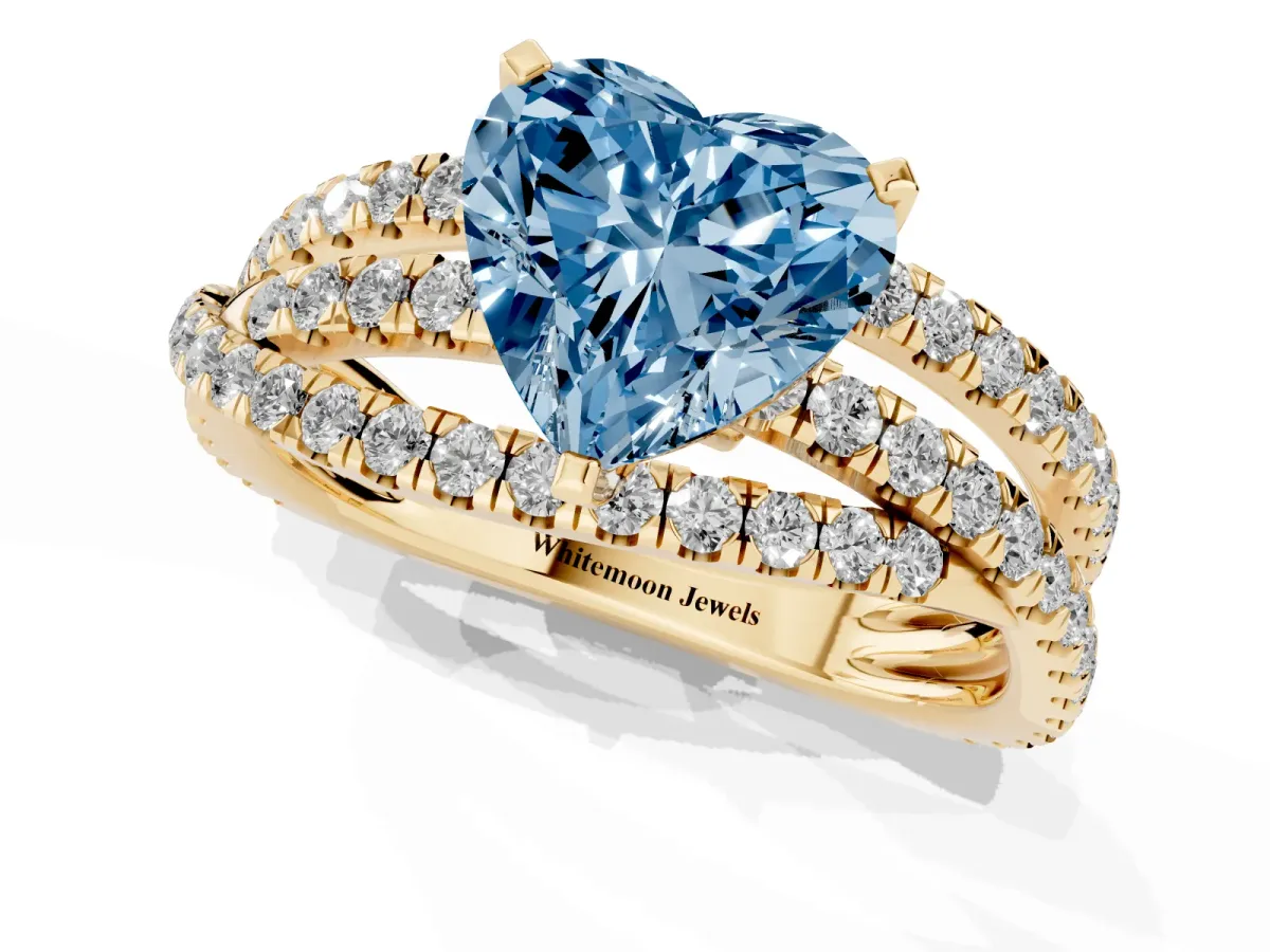 Fancy Blue Heart Cut Solitaire Twist Band with Pavé Setting and Four-Prong Setting Yellow gold