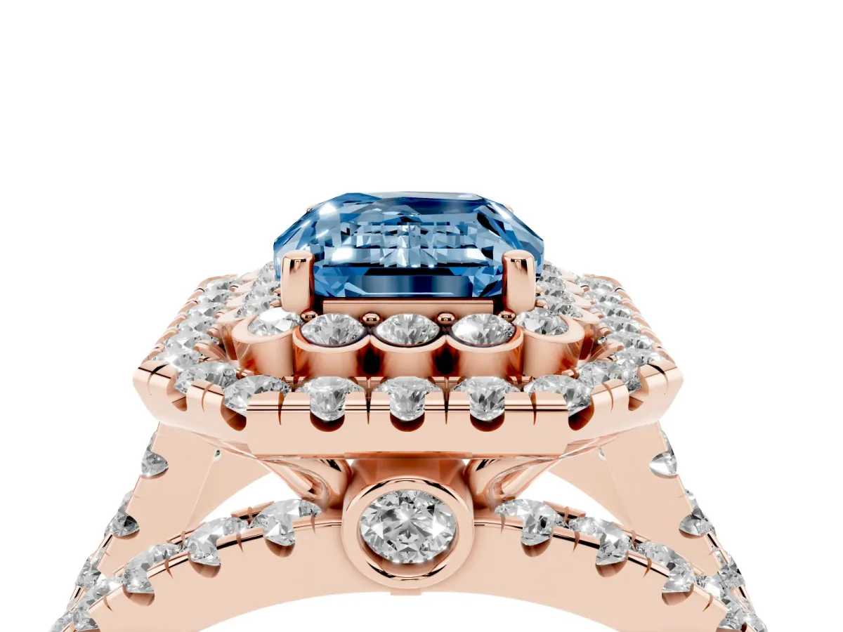 Fancy Blue Emerald Cut Diamond Double Halo Ring with Round Pavé Split Shank and Prong Setting Rose gold
