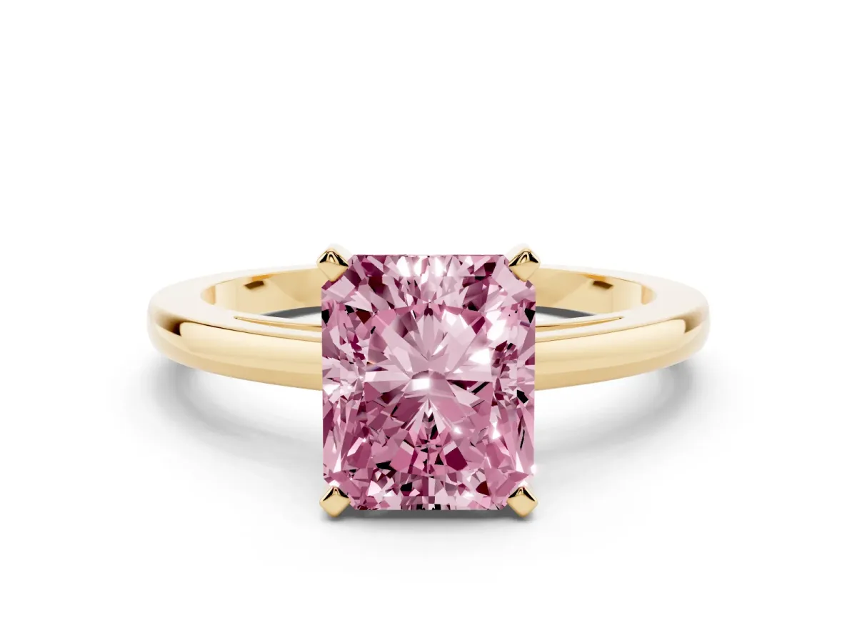 Fancy Pink Radiant Cut Solitaire Diamond Engagement Ring with Four-Prong Setting on a Classic Band Yellow gold