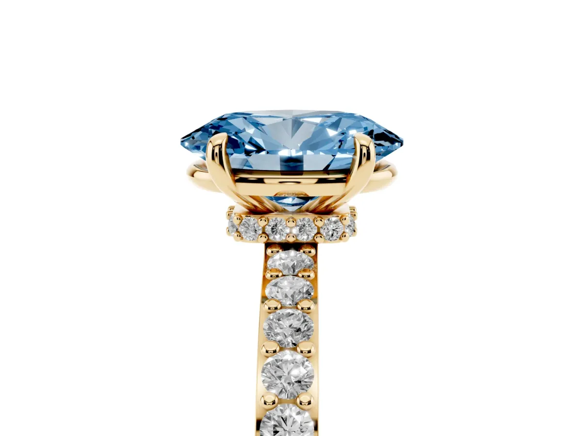 Fancy Blue Oval Cut Diamond Pavé Engagement Ring with Round Accents and Prong Setting Yellow gold