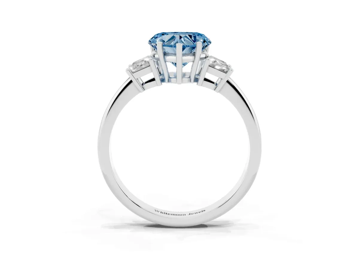 Fancy Blue Heart Cut Diamond Three-Stone Ring with Trapezoid Side Stones and Prong Setting Silver