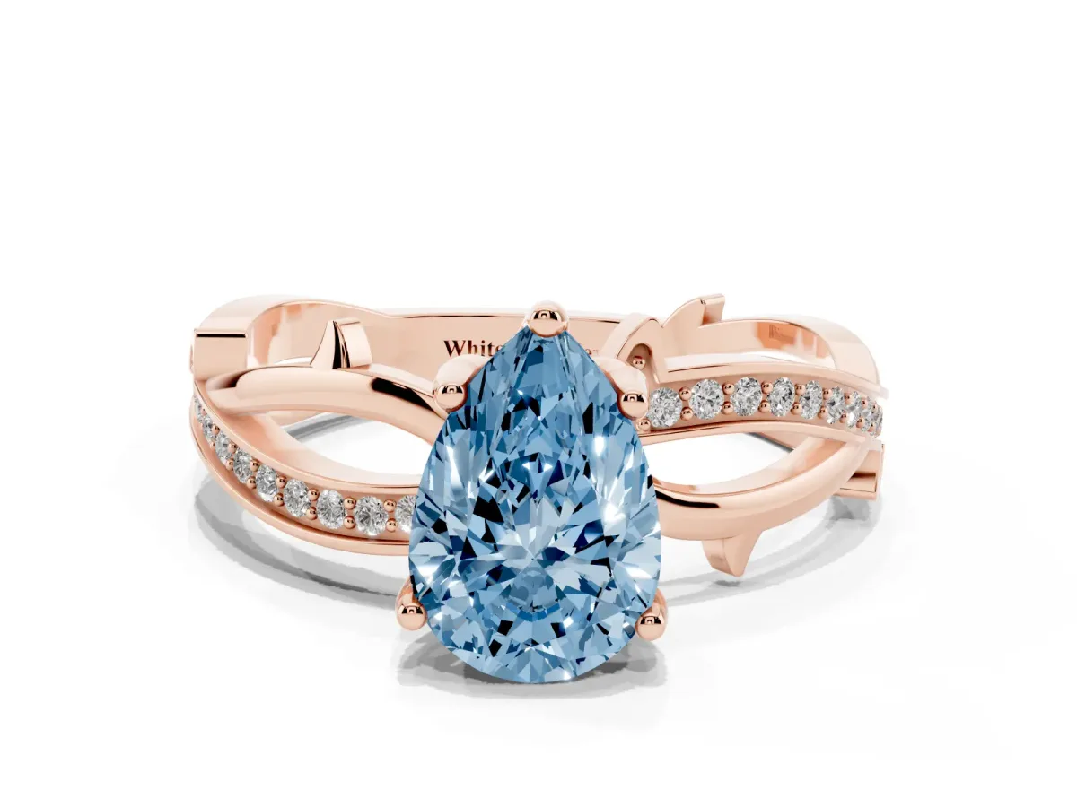 Fancy Blue Pear Cut Solitaire Twist Band with Pavé Accents and Four-Prong Setting Rose gold