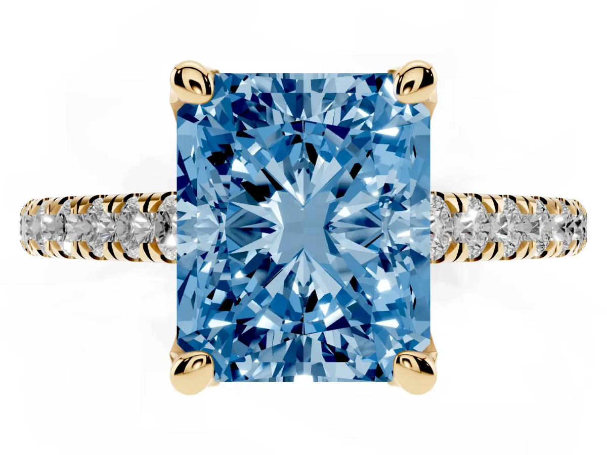 Fancy Blue Radiant Cut Brilliant Diamond Solitaire with Pavé Band and Four-Prong Setting Yellow gold