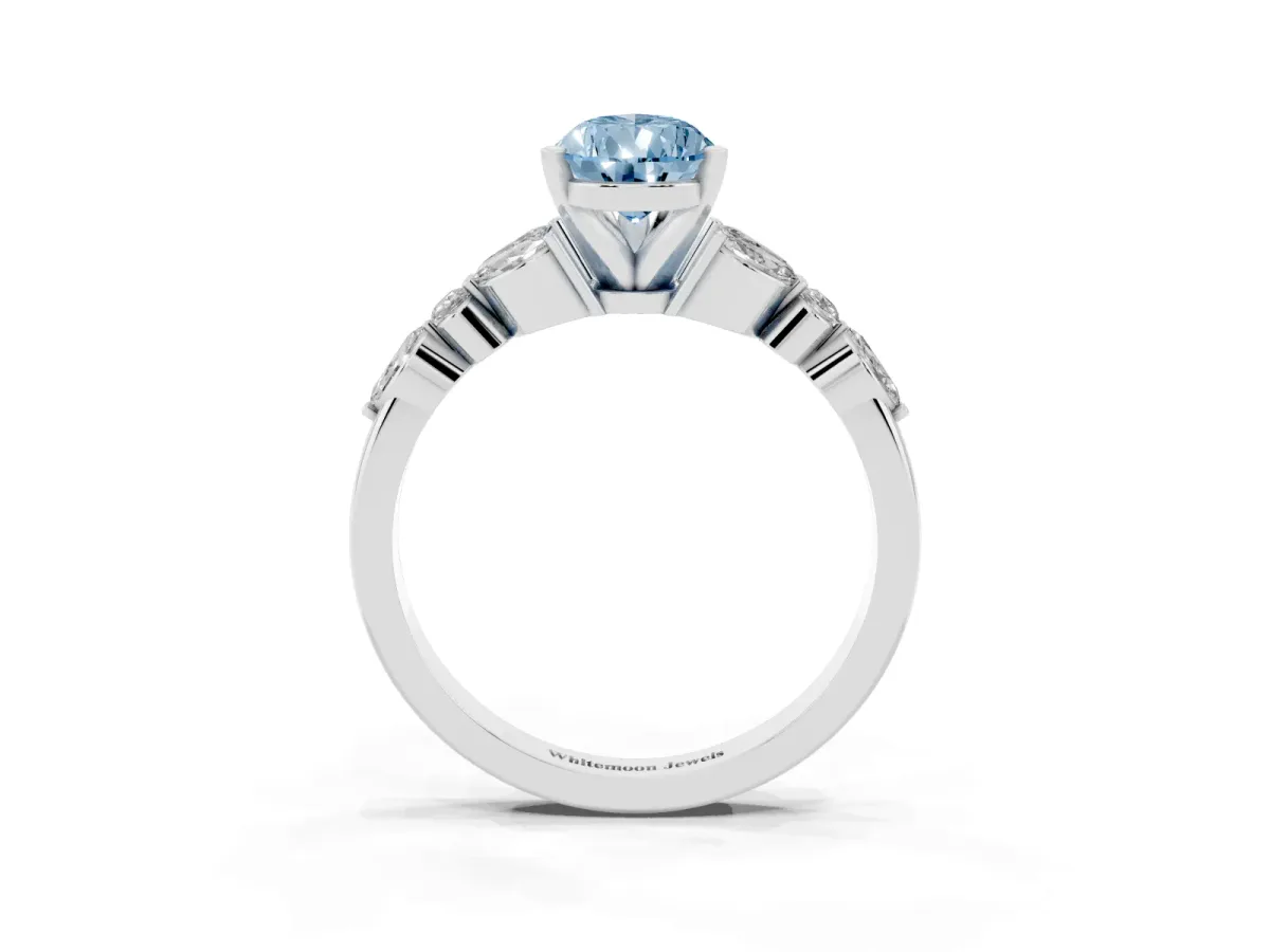 Fancy Blue Pear Cut Diamond Solitaire Ring with Side Stones and Four-Prong Setting Silver