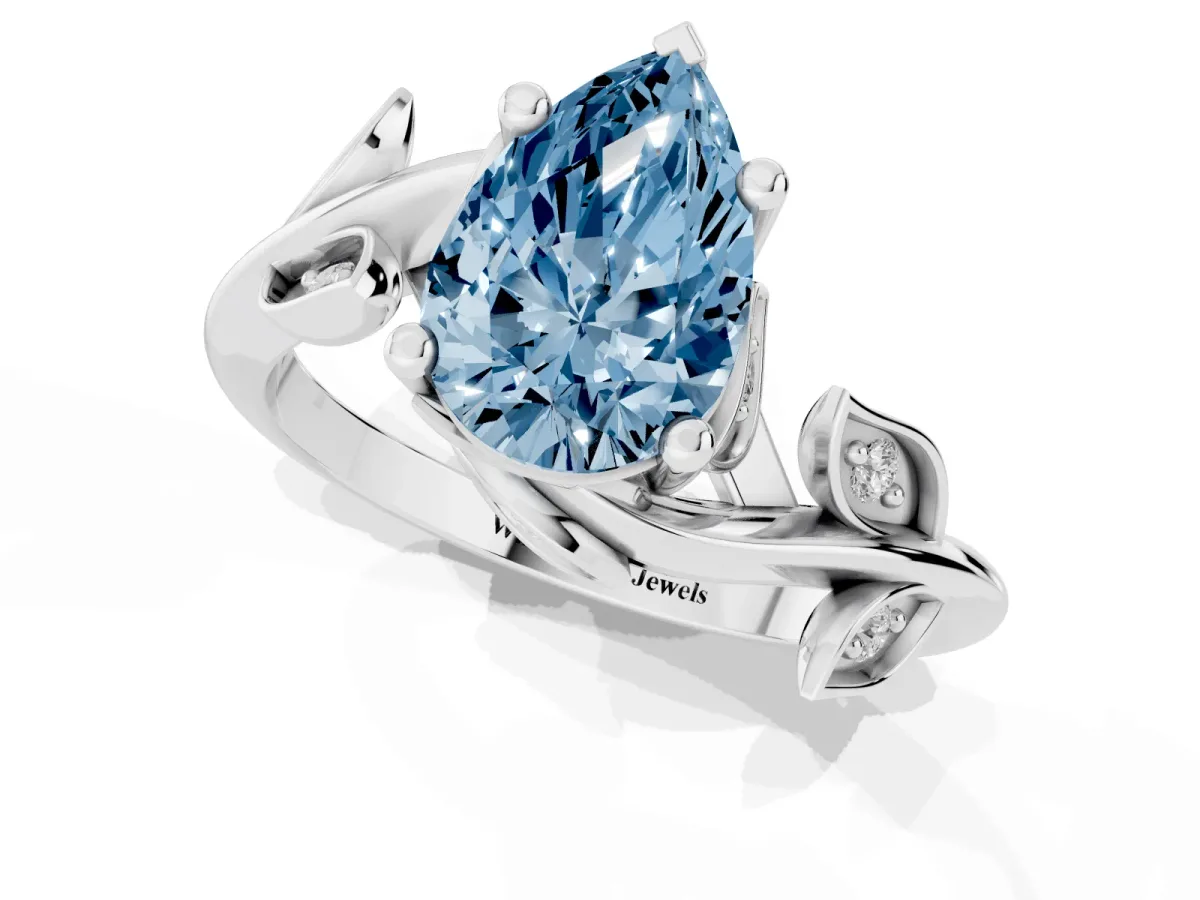 Fancy Blue Pear Cut Solitaire Twist Engagement Ring with Leaf Accents and Prong Setting Silver