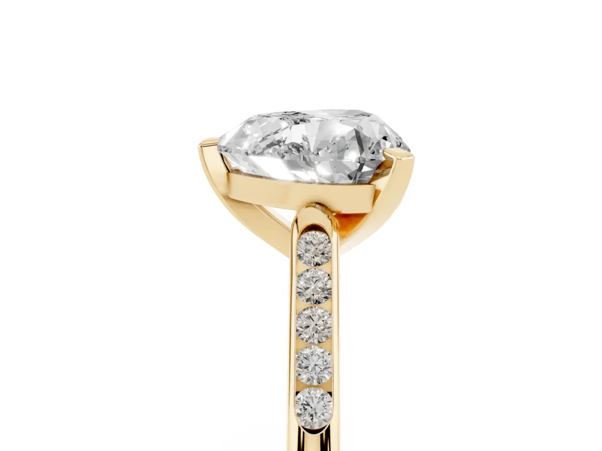 Heart Cut Diamond Solitaire Ring with Channel Set Round Band and Prong Setting Yellow gold