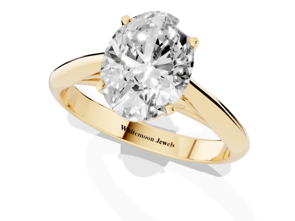 Oval Cut Diamond Solitaire Engagement Ring with Cathedral Setting and Four-Prong Mount Yellow gold