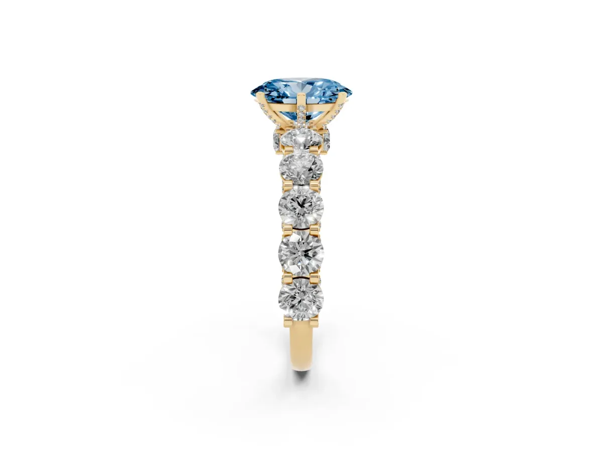 Fancy Blue Oval Cut Diamond Side Stone Engagement Ring with Four-Prong Setting Yellow gold