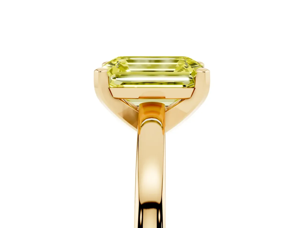 Fancy Yellow Emerald Cut Solitaire Diamond Engagement Ring with Four-Prong Setting on a Classic Band Yellow gold