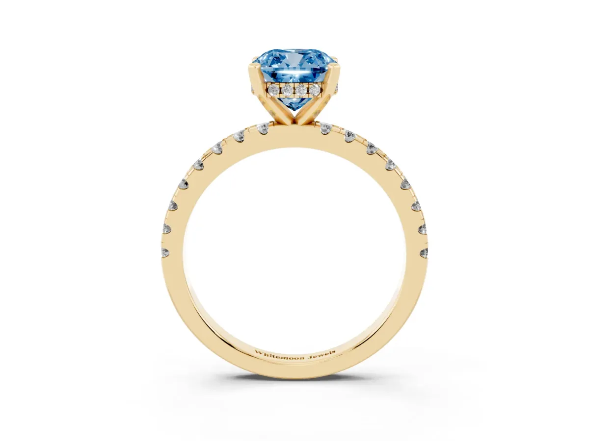 Fancy Blue Cushion Cut Diamond Solitaire Ring with Round Pavé Band and Four-Prong Setting Yellow gold
