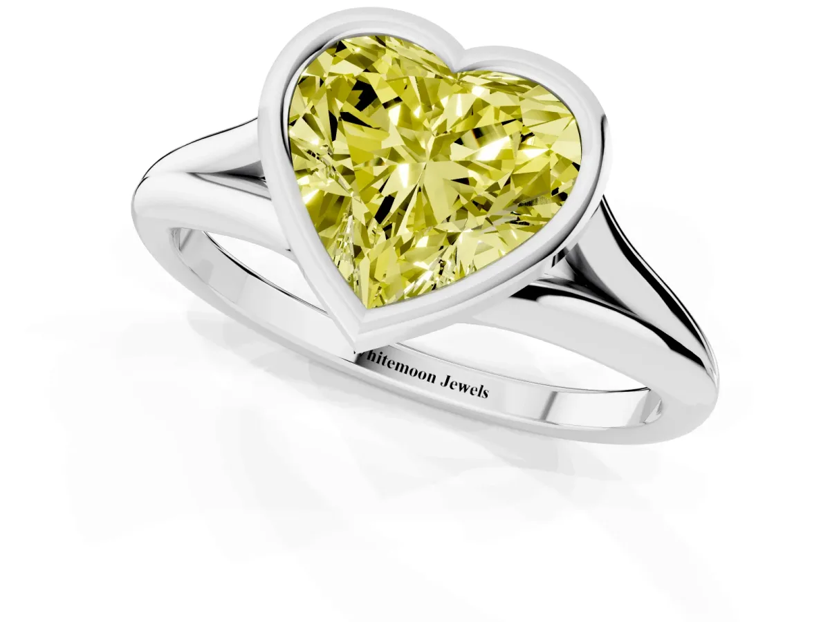 Fancy Yellow Bezel Set Heart Cut Cut Solitaire Ring with Tapered Band White gold