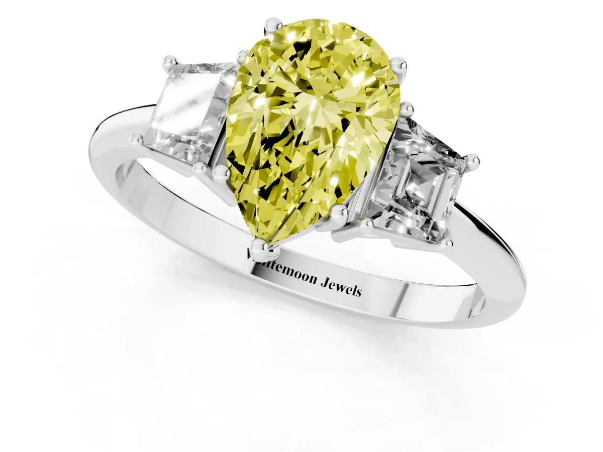 Fancy Yellow Pear Cut Diamond Three-Stone Ring with Trapezoid Side Stones and Prong Setting Platinum