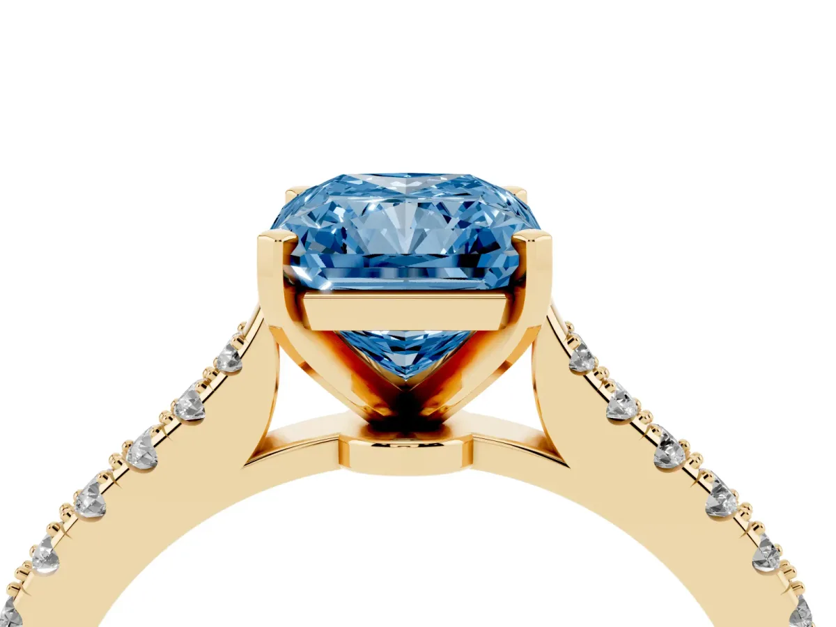 Fancy Blue Radiant Cut Cut Solitaire Diamond Engagement Ring with Pave Band and Four-Prong Setting Yellow gold