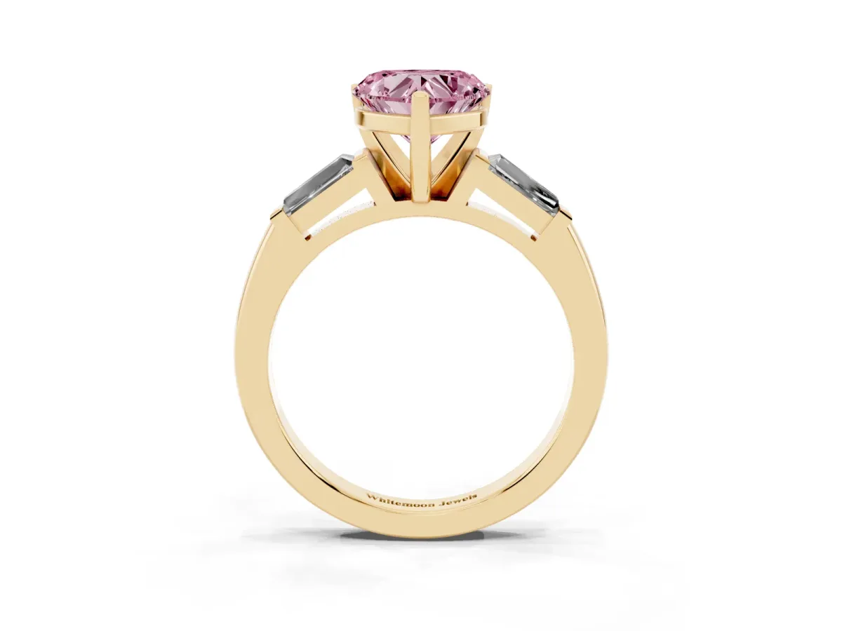 Fancy Pink Heart Cut Solitaire with Tapered Baguette Side Stones on a Classic Band with Four-Prong Setting Yellow gold