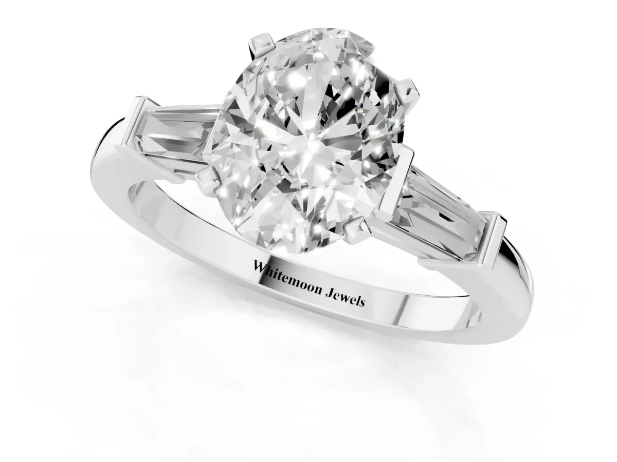 Oval Cut Cut Diamond Solitaire Ring with Tapered Baguette Accents and Four-Prong Setting Platinum