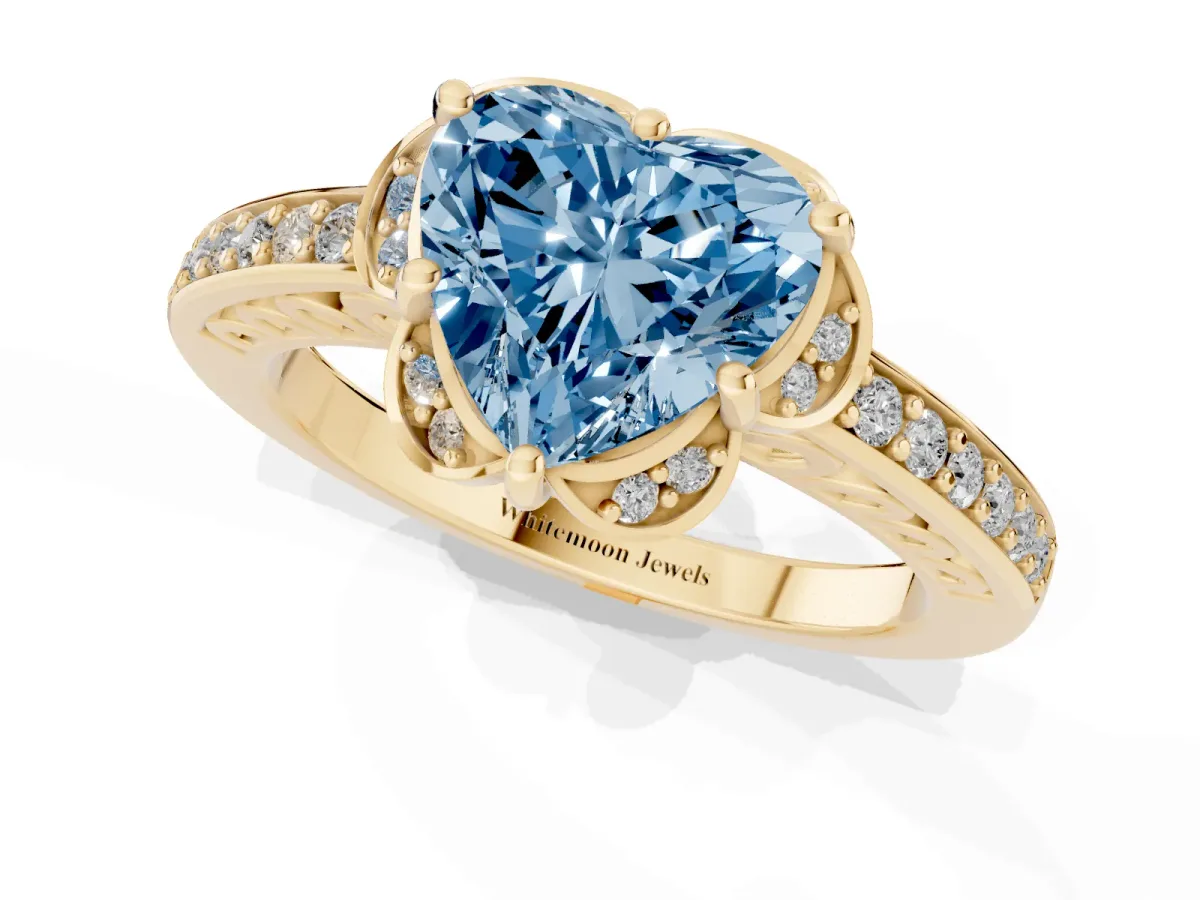Fancy Blue Heart Cut Cut Halo Diamond Ring with Channel Set Band and Four-Prong Setting Yellow gold
