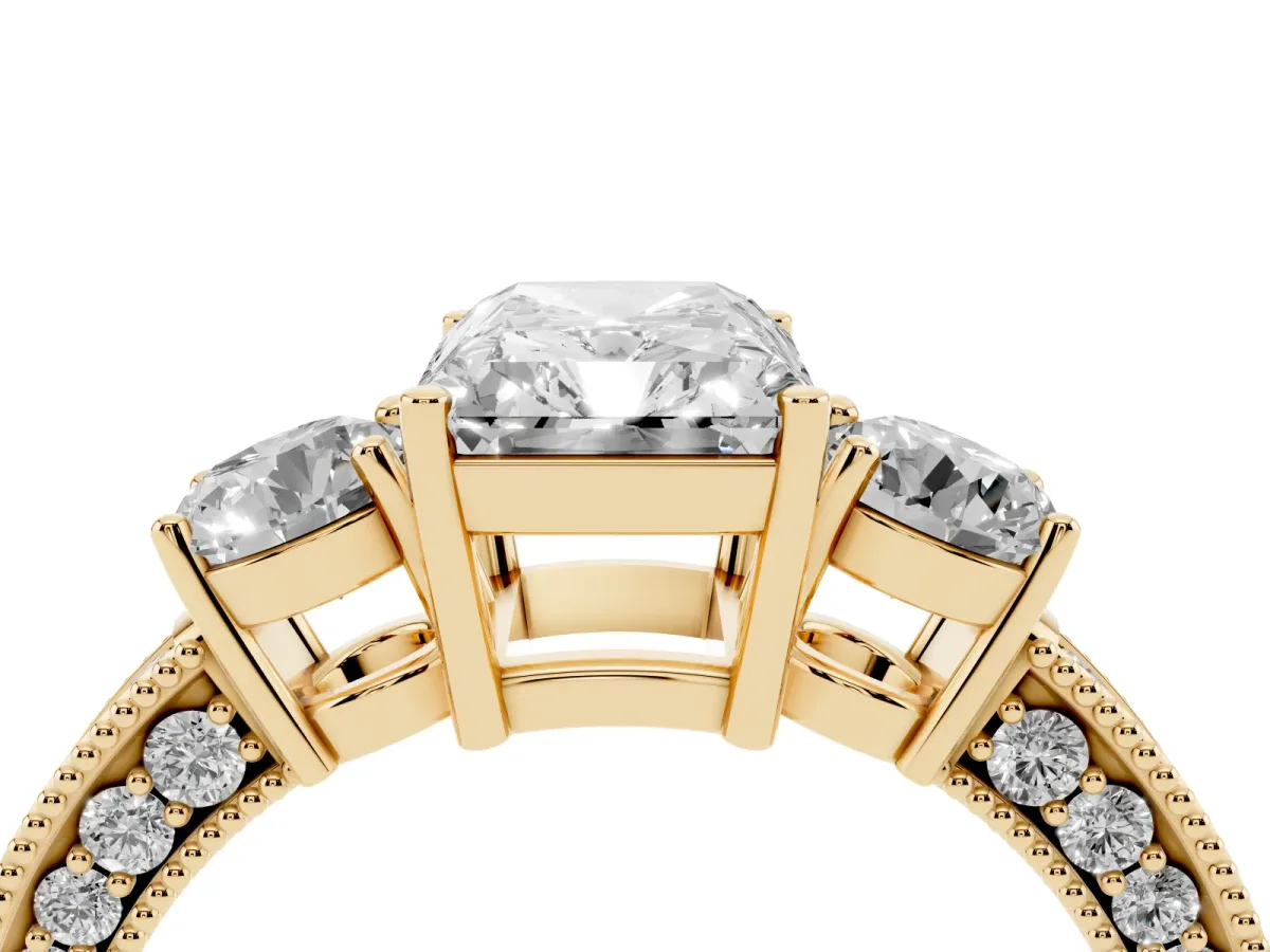 Radiant Cut Three-Stone Diamond Ring with Pavé Band and Four-Prong Setting Yellow gold