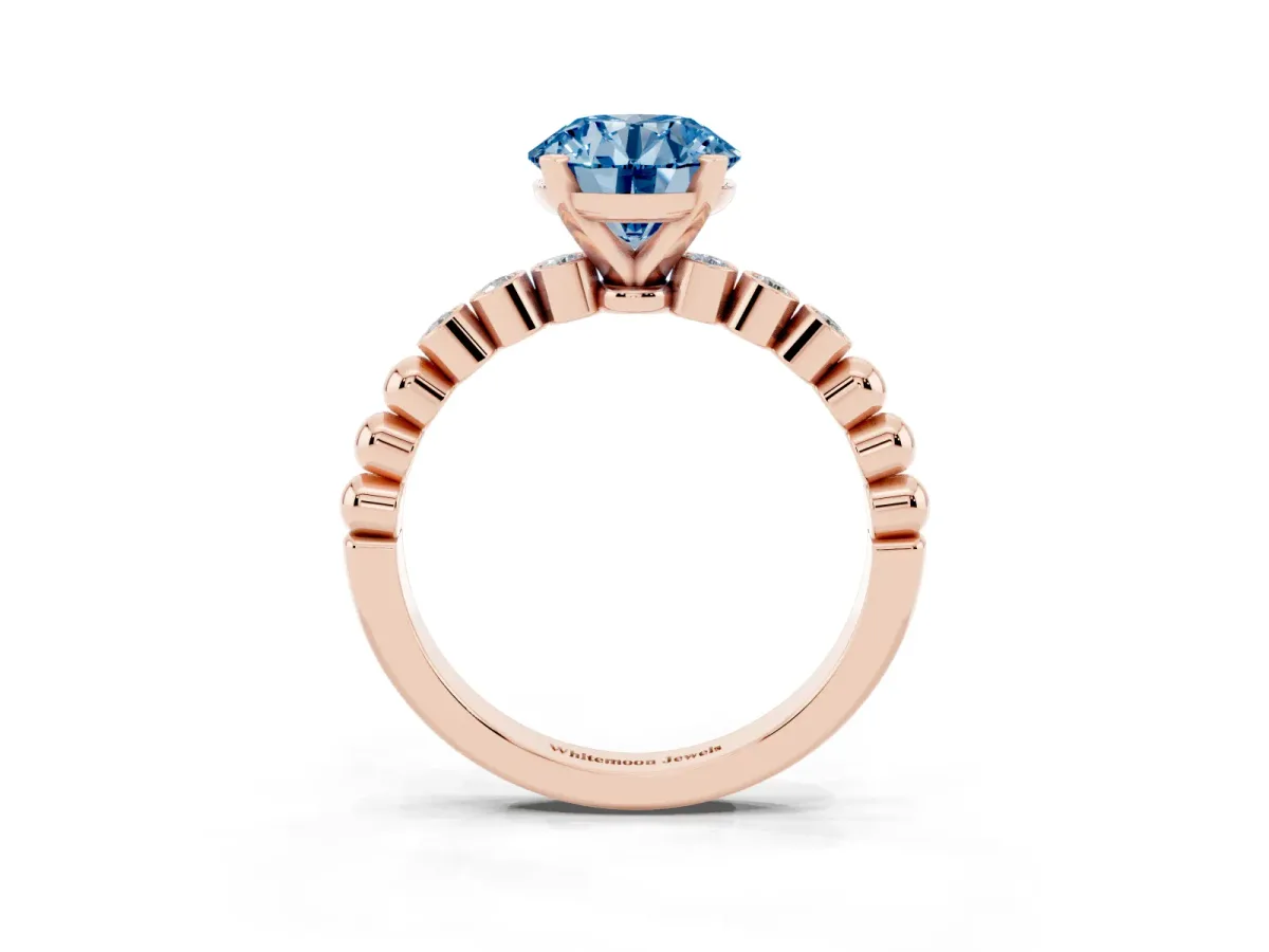 Fancy Blue Round Cut Solitaire Bezel Accent Diamond Engagement Ring with Beaded Band and Four-Prong Setting Rose gold