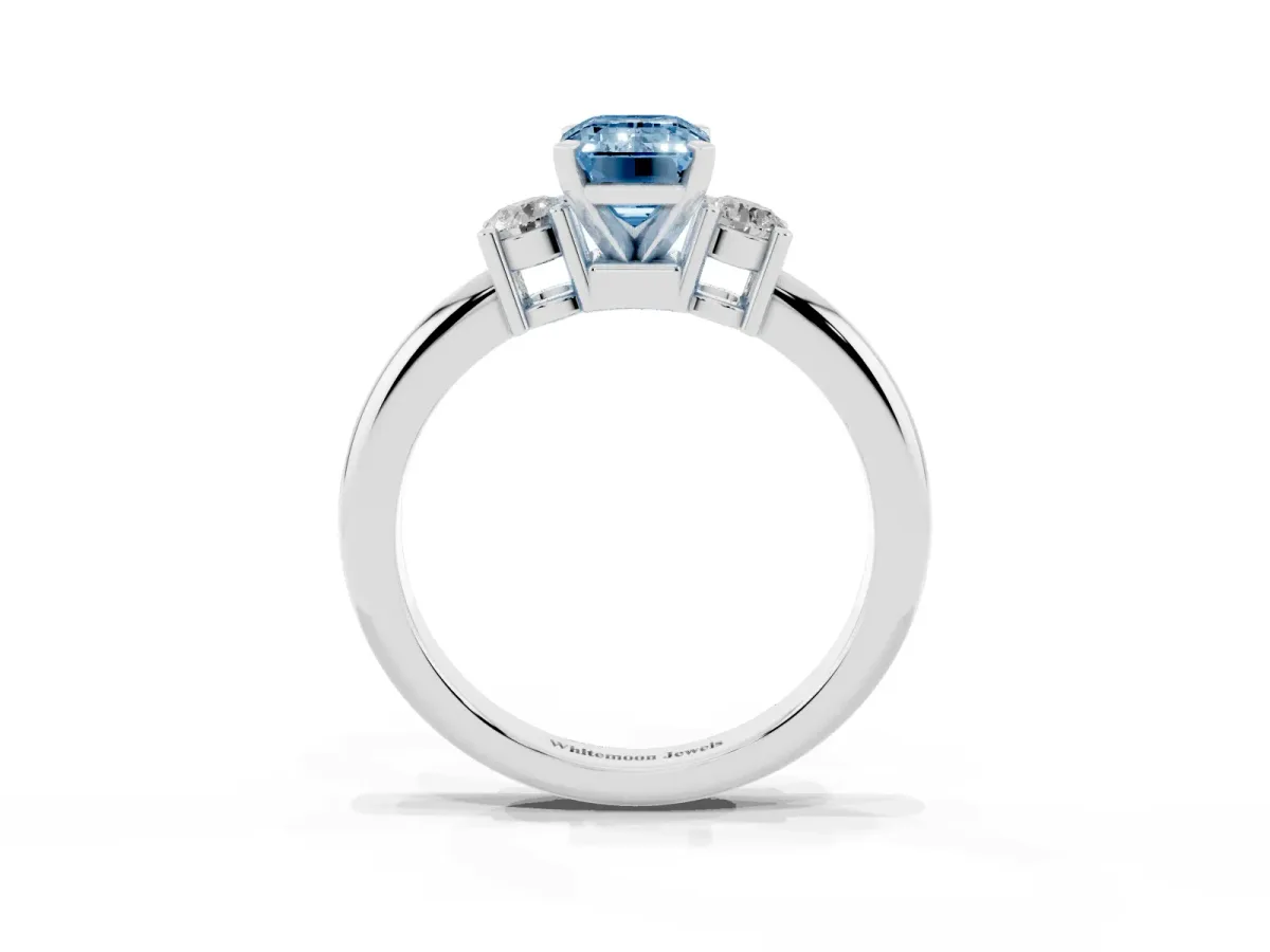 Fancy Blue Three-Stone Emerald Cut Cut Diamond Solitaire with Prong Setting and Classic Band Silver