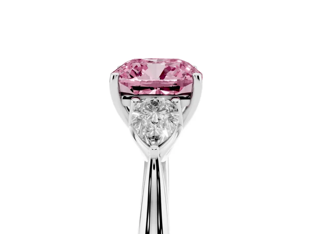 Fancy Pink Three-Stone Cushion Cut Diamond Ring with Pear Side Stones in Four-Prong Setting Platinum