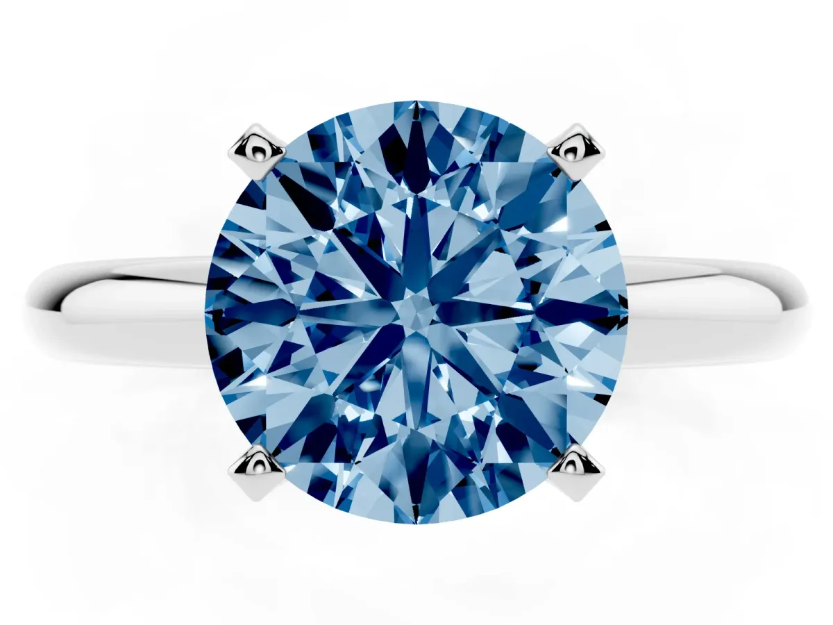 Fancy Blue Round Cut Diamond Solitaire Engagement Ring with Round Band and Four-Prong Setting Silver