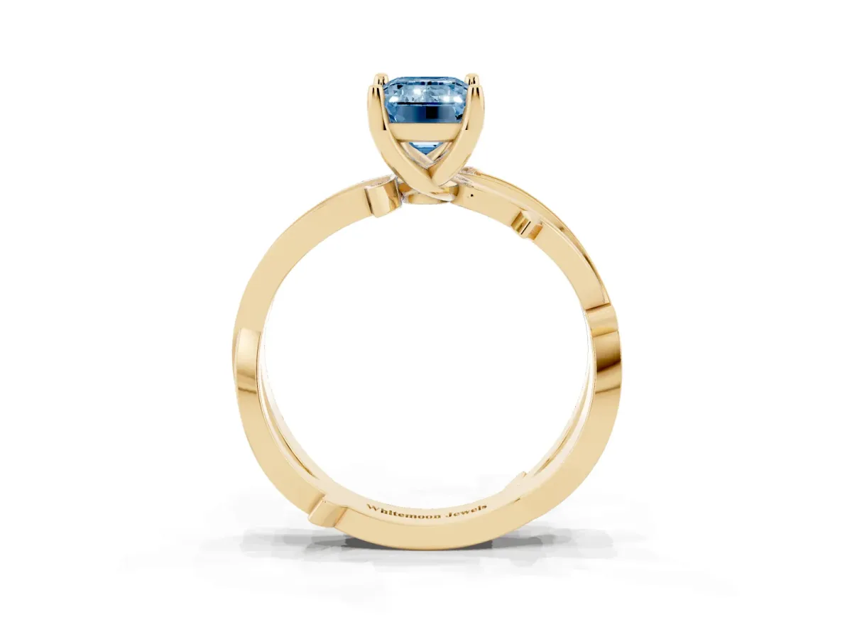 Fancy Blue Emerald Cut Solitaire Twist Band with Pavé Accents and Four-Prong Setting Yellow gold