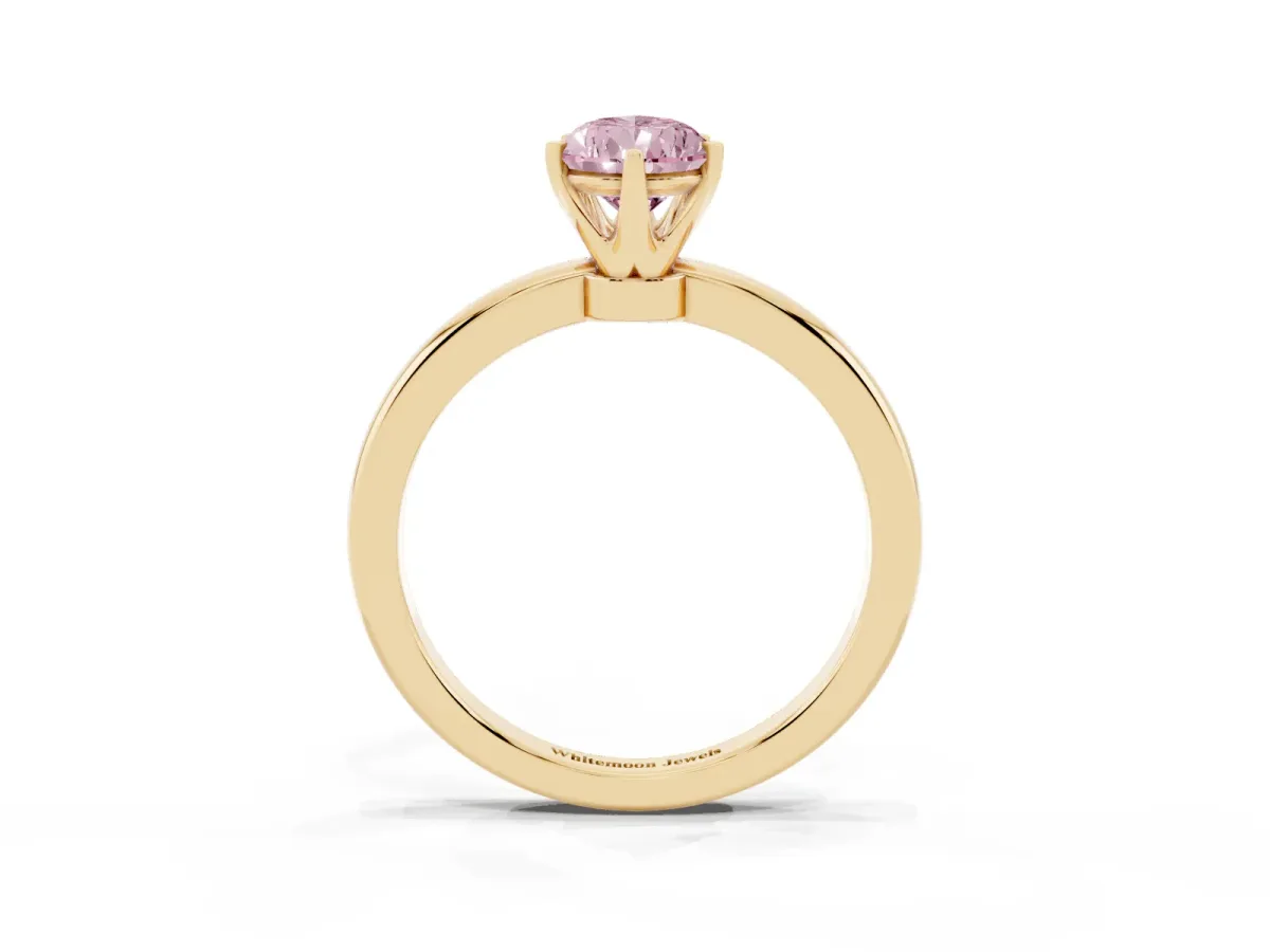 Fancy Pink Pear Cut Solitaire Diamond Ring with Six-Prong Setting on a Classic Band Yellow gold