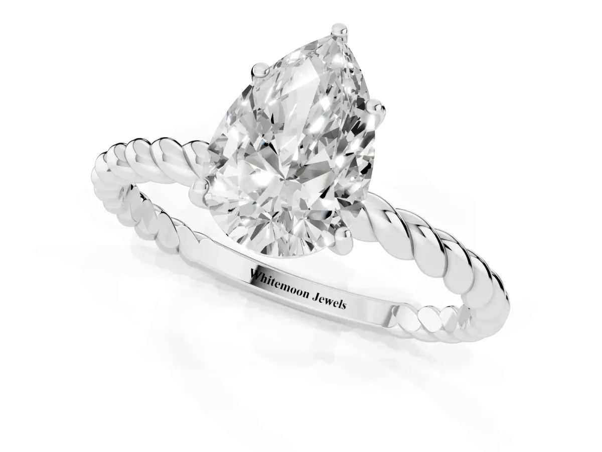 Pear Cut Solitaire Twist Band Ring with Four-Prong Setting Platinum