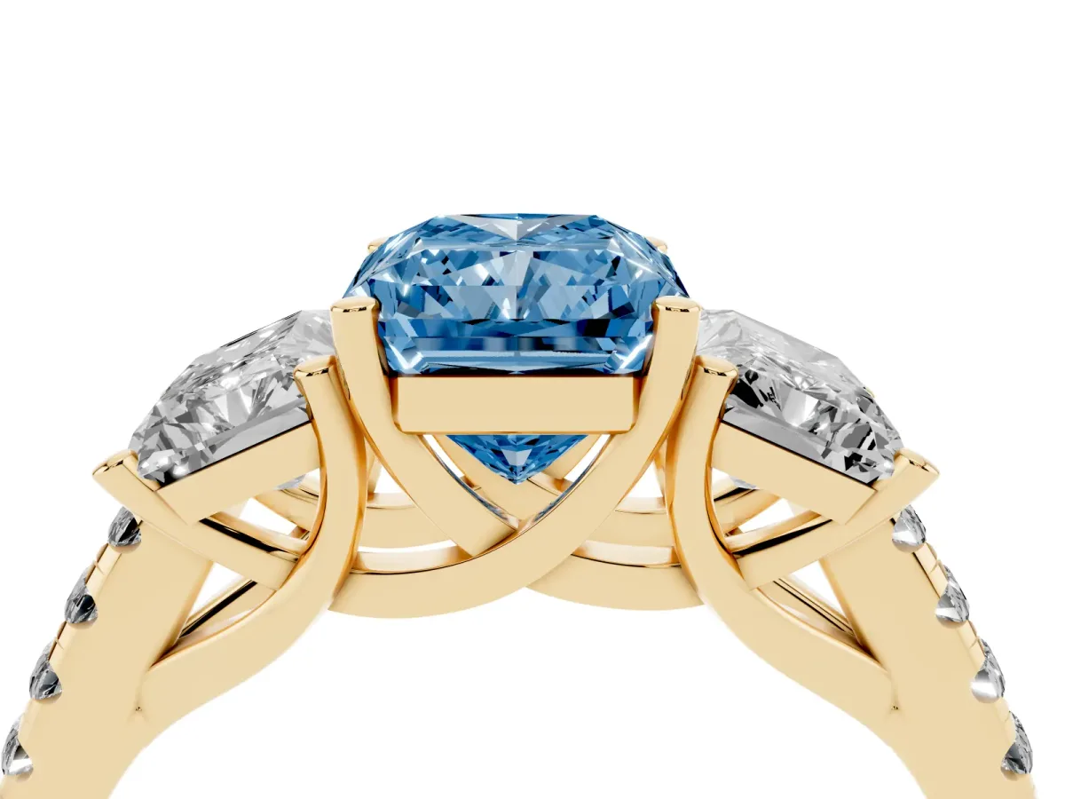 Fancy Blue Three-Stone Radiant Cut Diamond Ring with Round Pavé Band and Prong Setting Yellow gold