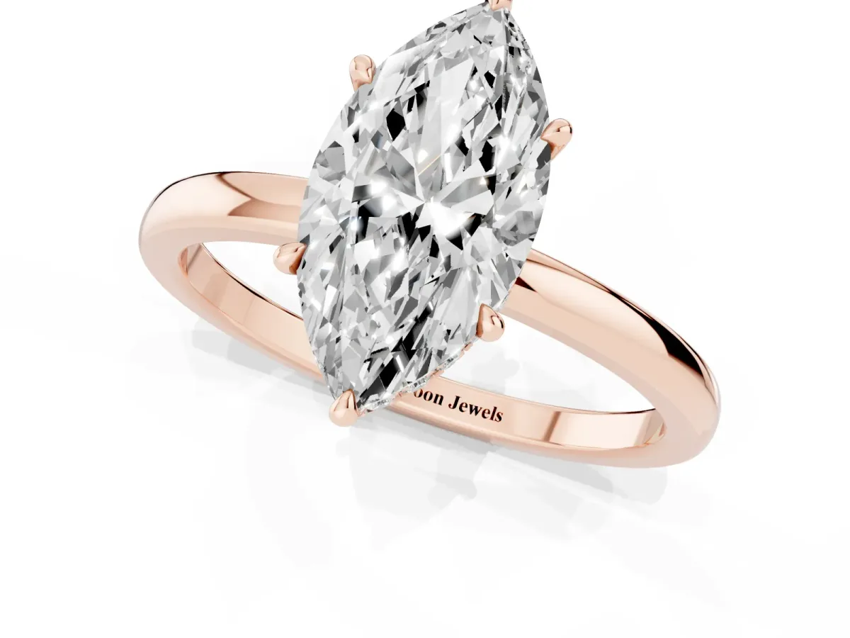 Marquise Cut Solitaire Engagement Ring with Cathedral Band and Four-Prong Setting Rose gold