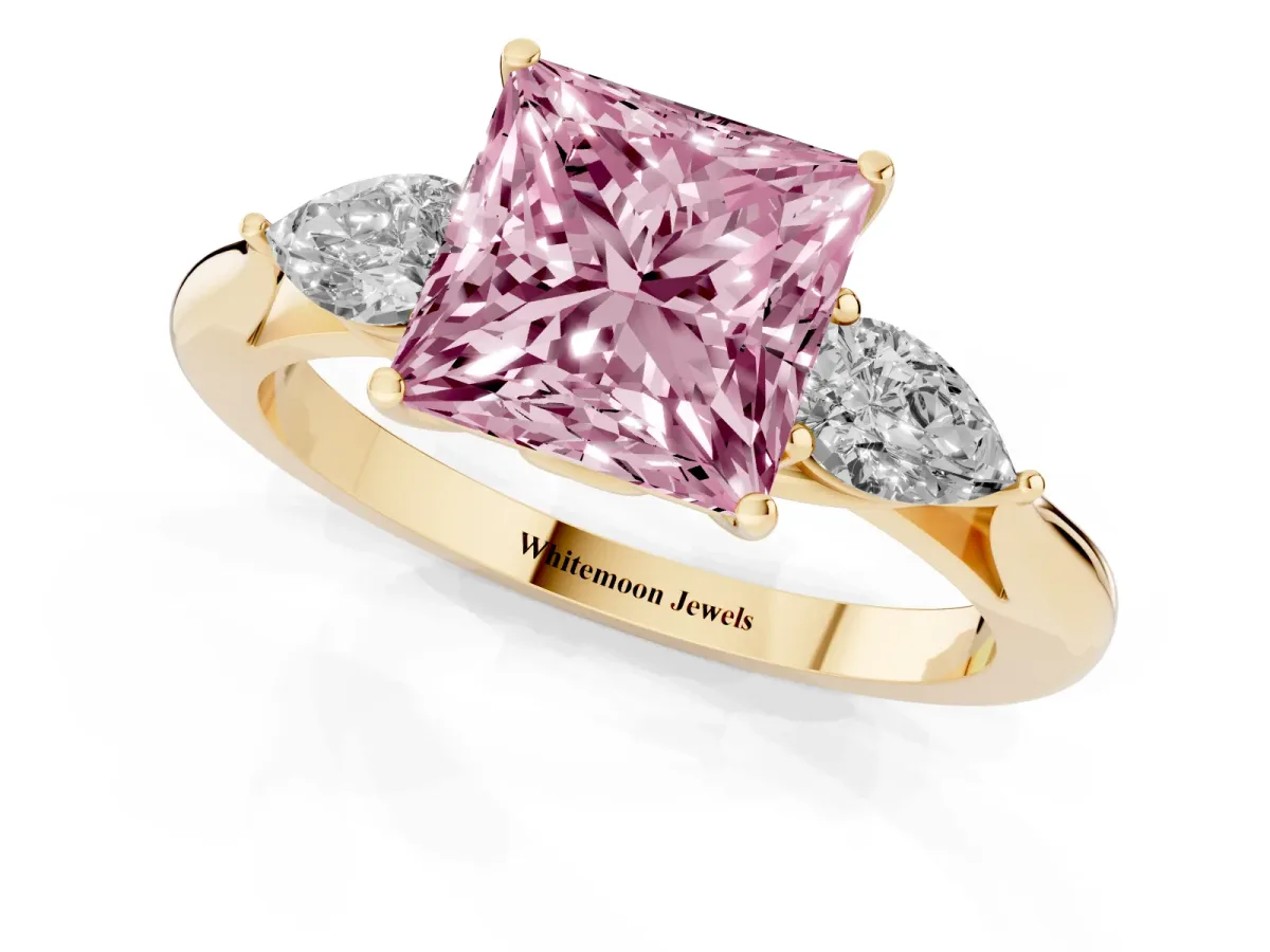 Fancy Pink Three-Stone Princess Cut Diamond Ring with Pear Side Stones in Four-Prong Setting Yellow gold