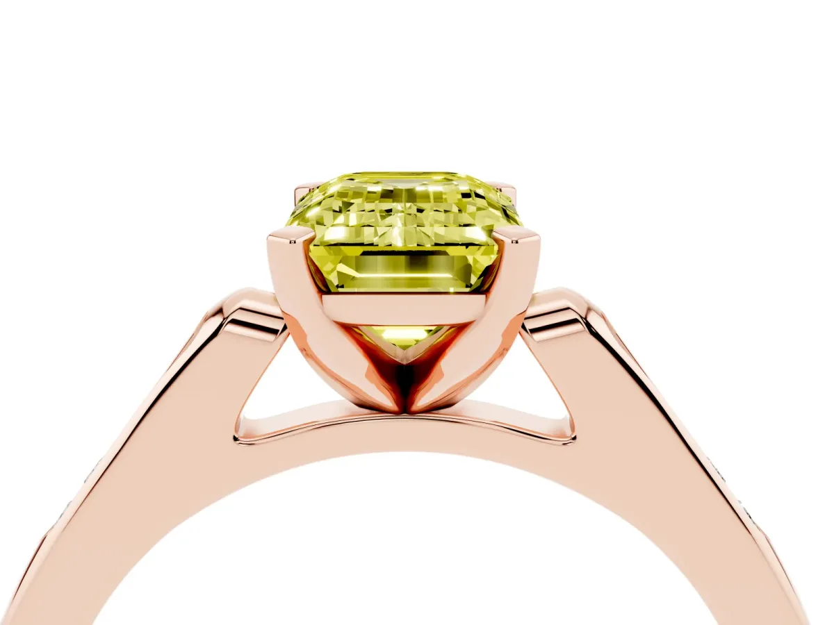 Fancy Yellow Emerald Cut Diamond Solitaire Ring with Channel Set Round Band and Prong Setting Rose gold