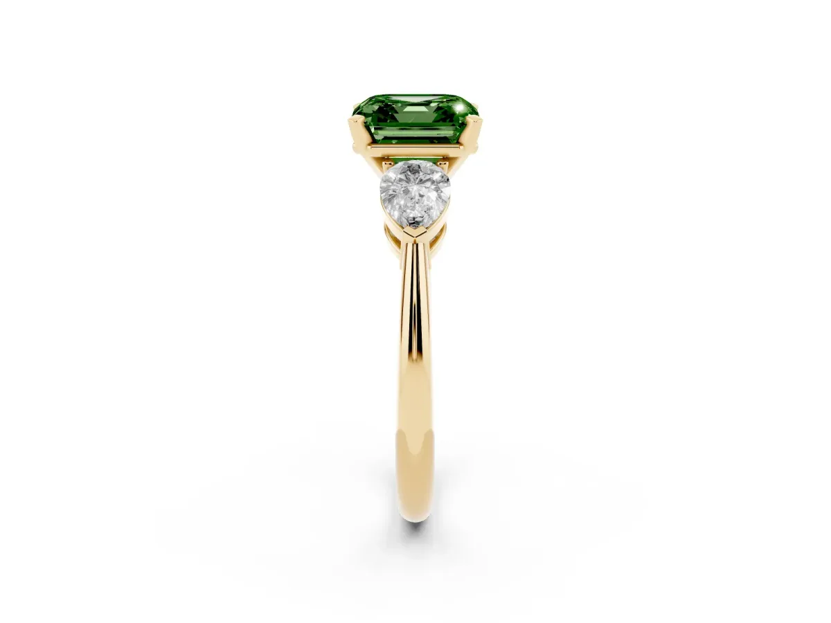 Fancy Green Three-Stone Asscher Cut Diamond Ring with Pear Side Stones and Four-Prong Setting Yellow gold