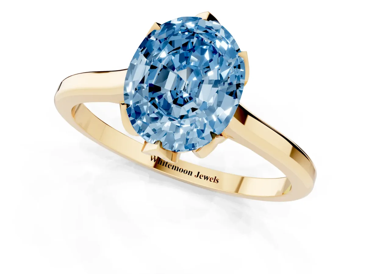 Fancy Blue Oval Cut Diamond Solitaire Ring with Flower Prong Setting and Classic Band Yellow gold