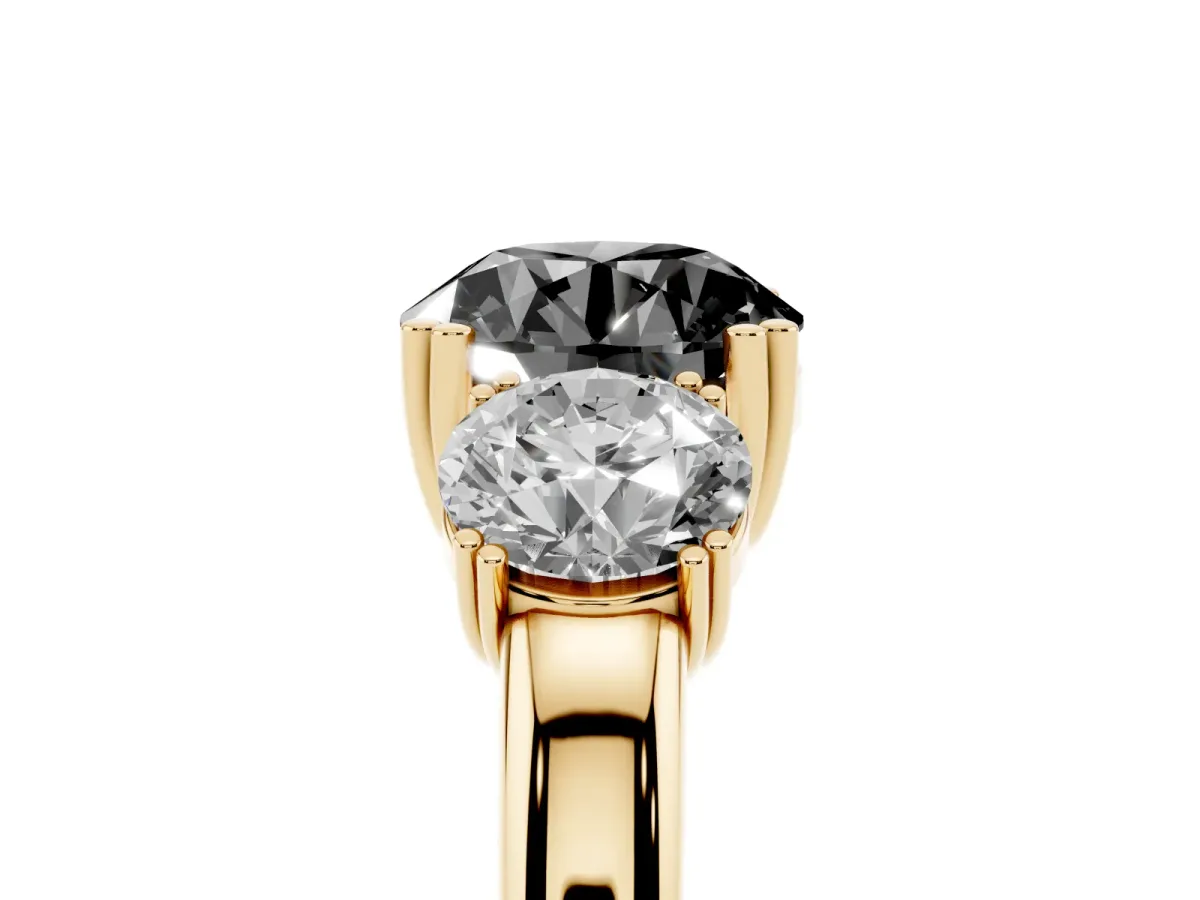 Fancy Black Three-Stone Round Cut Cut Diamond Ring with Channel Set Band and Four-Prong Setting Yellow gold