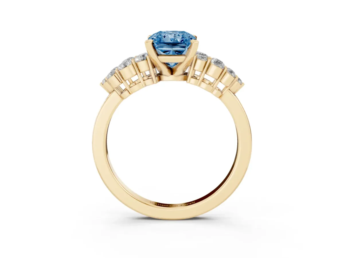 Fancy Blue Radiant Cut Cluster Diamond Engagement Ring with Pavé Band and Four-Prong Setting Yellow gold