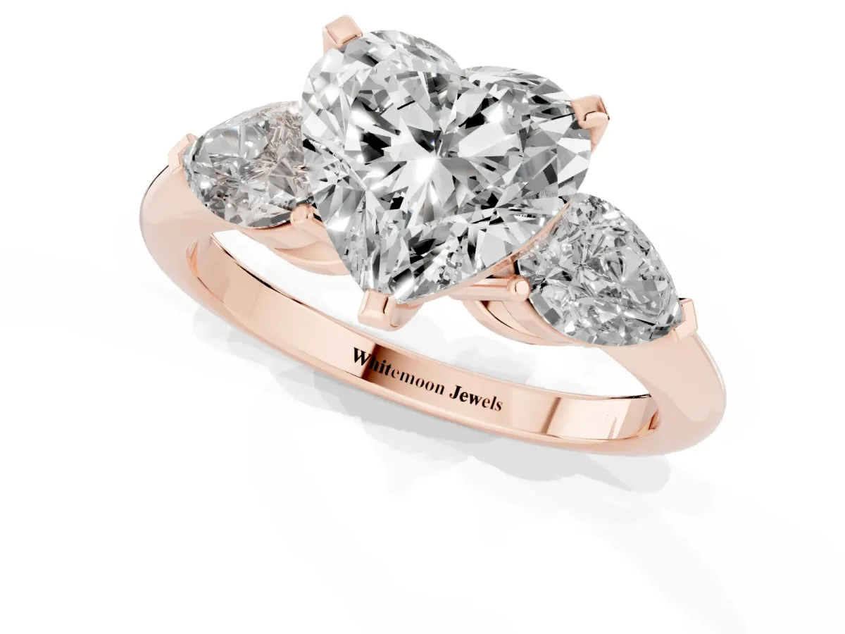 Three-Stone Heart Cut Diamond Ring with Pear Side Stones and Four-Prong Setting Rose gold