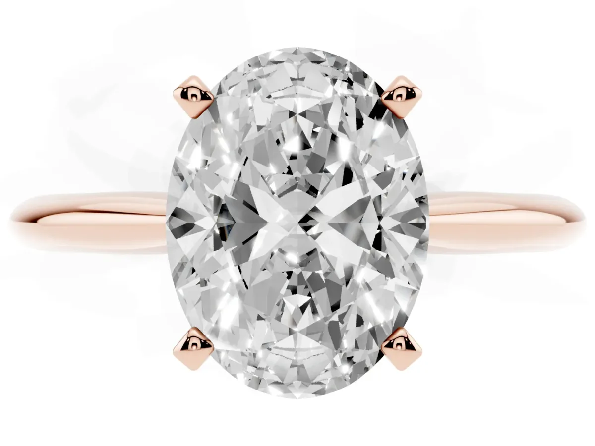Oval Cut Cut Solitaire Ring with Four-Prong Setting on a Classic Band Rose gold