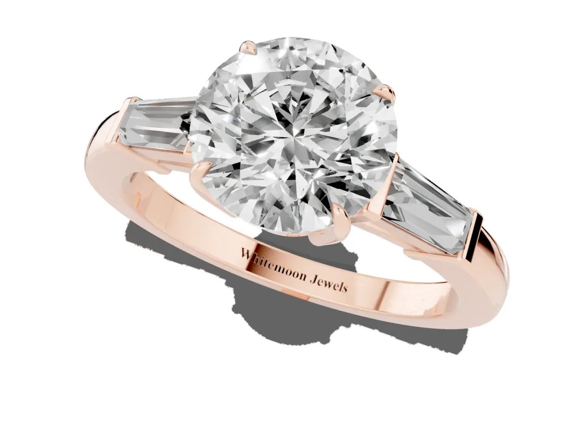 Round Cut Diamond Three-Stone Ring with Tapered Baguette Side Stones and Prong Setting Rose gold