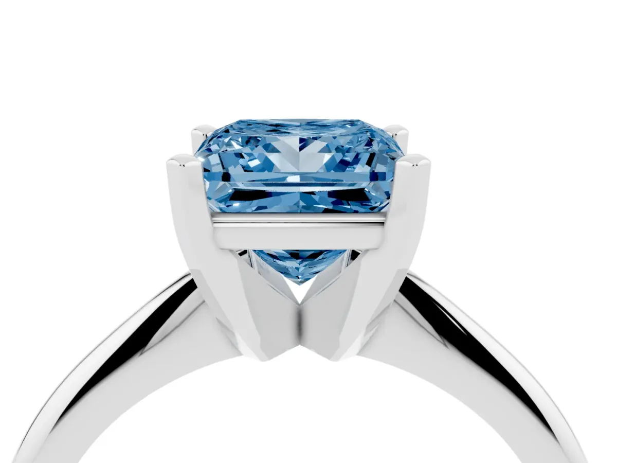 Fancy Blue Princess Cut Cut Solitaire Ring with Four-Prong Setting on a Classic Band Silver