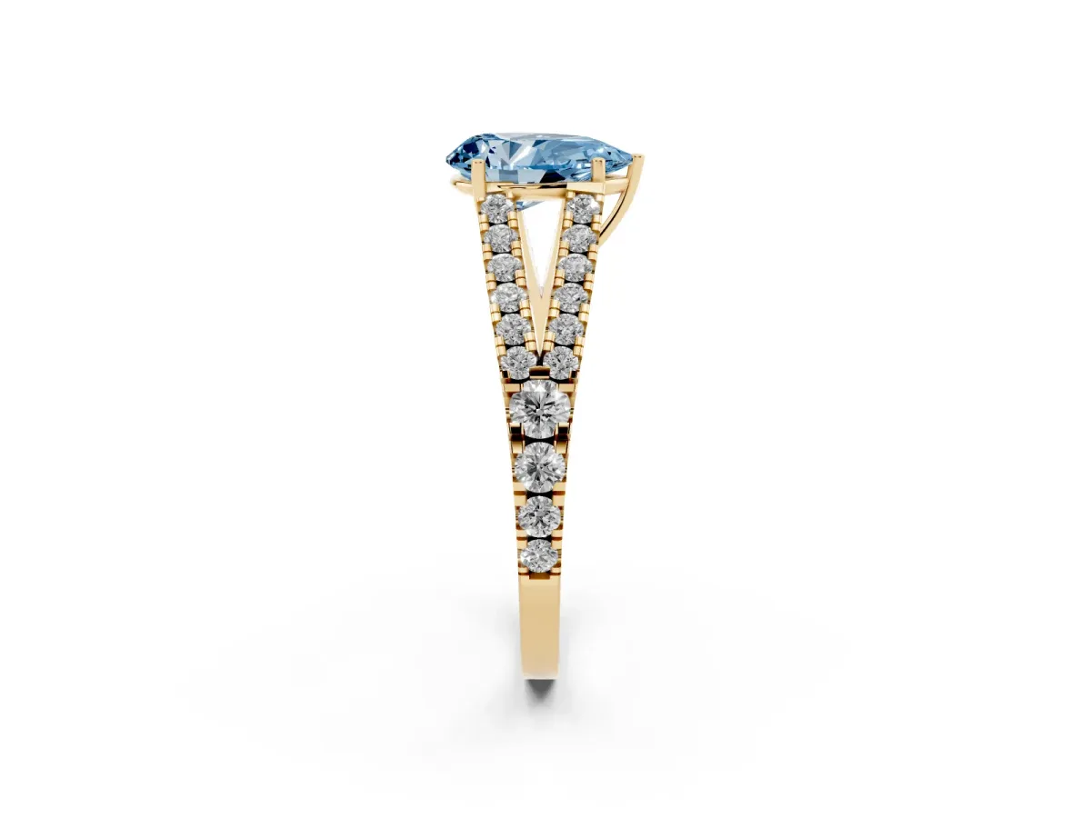 Fancy Blue Pear Cut Diamond Split Shank Pavé Engagement Ring with Four-Prong Setting Yellow gold