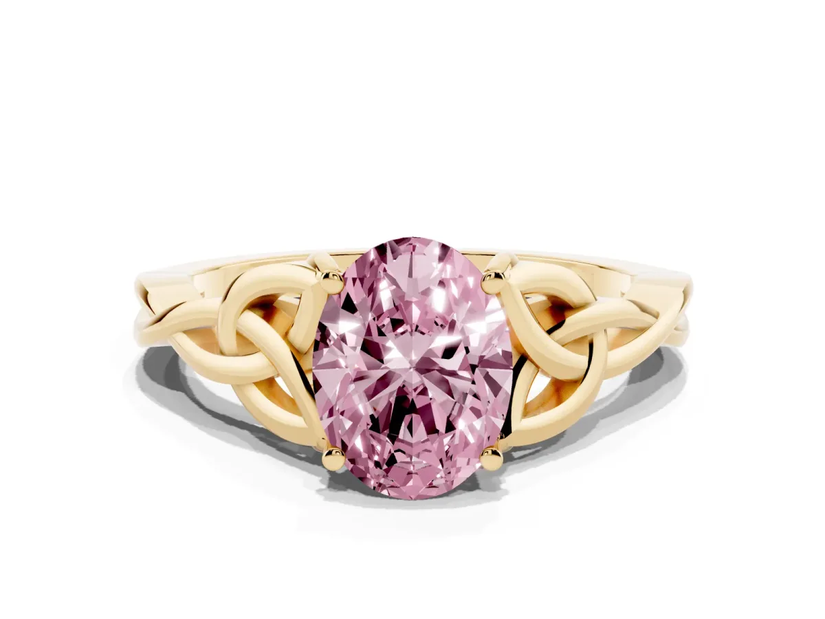 Fancy Pink Oval Cut Diamond Solitaire Engagement Ring with Celtic Knot Band and Four-Prong Setting Yellow gold
