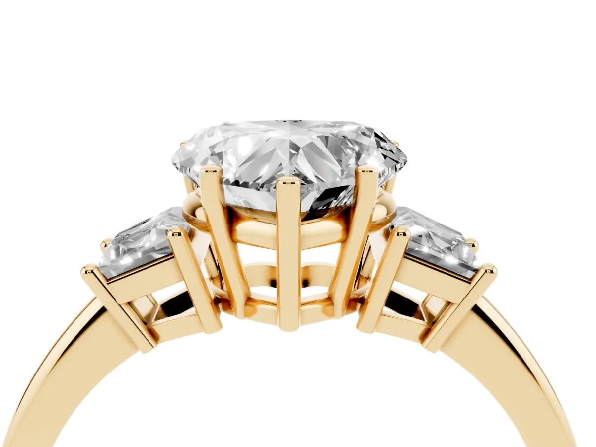 Heart Cut Diamond Three-Stone Ring with Trapezoid Side Stones and Prong Setting Yellow gold