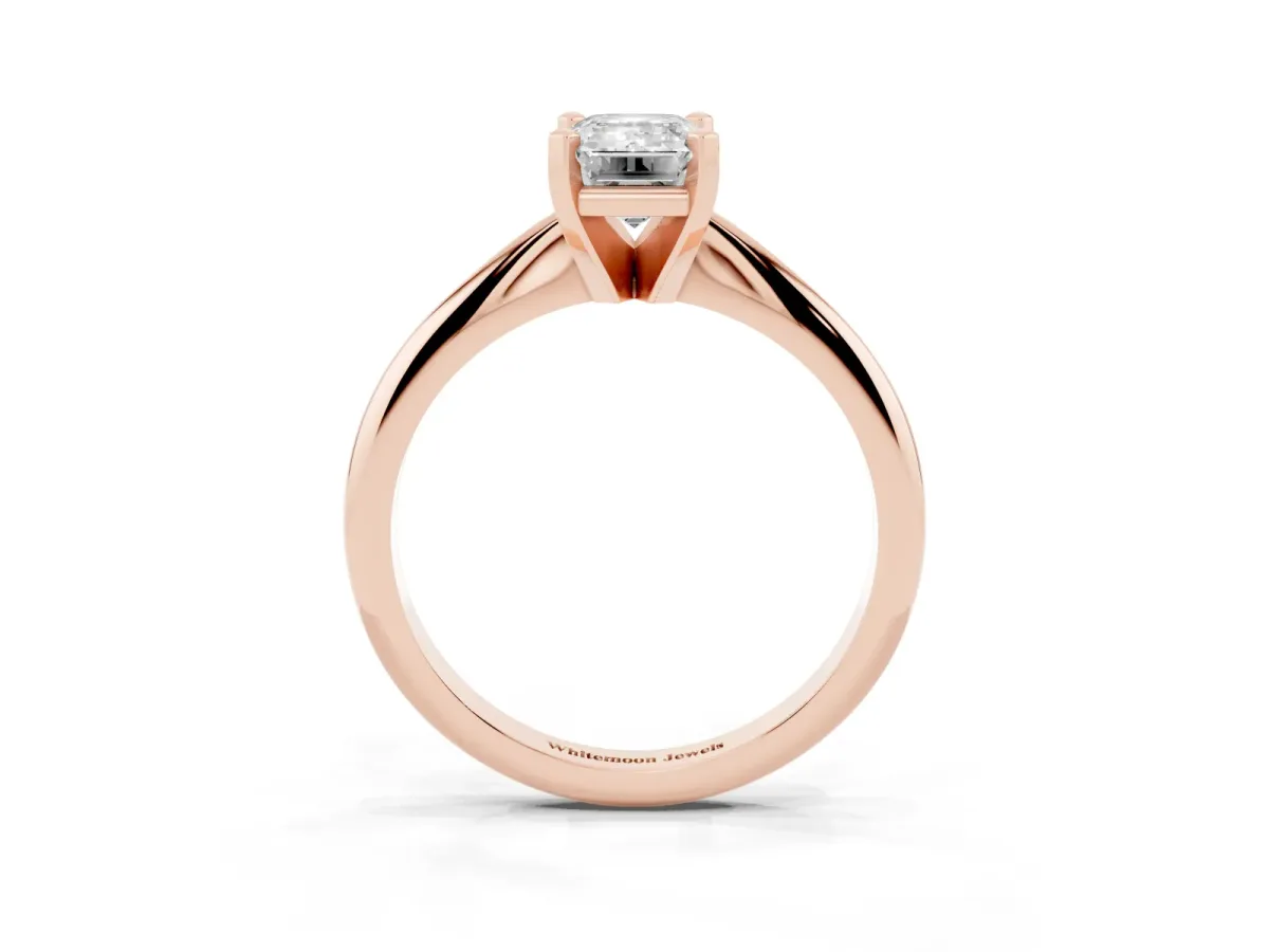 Emerald Cut Cut Solitaire Ring with Four-Prong Setting on a Classic Band Rose gold