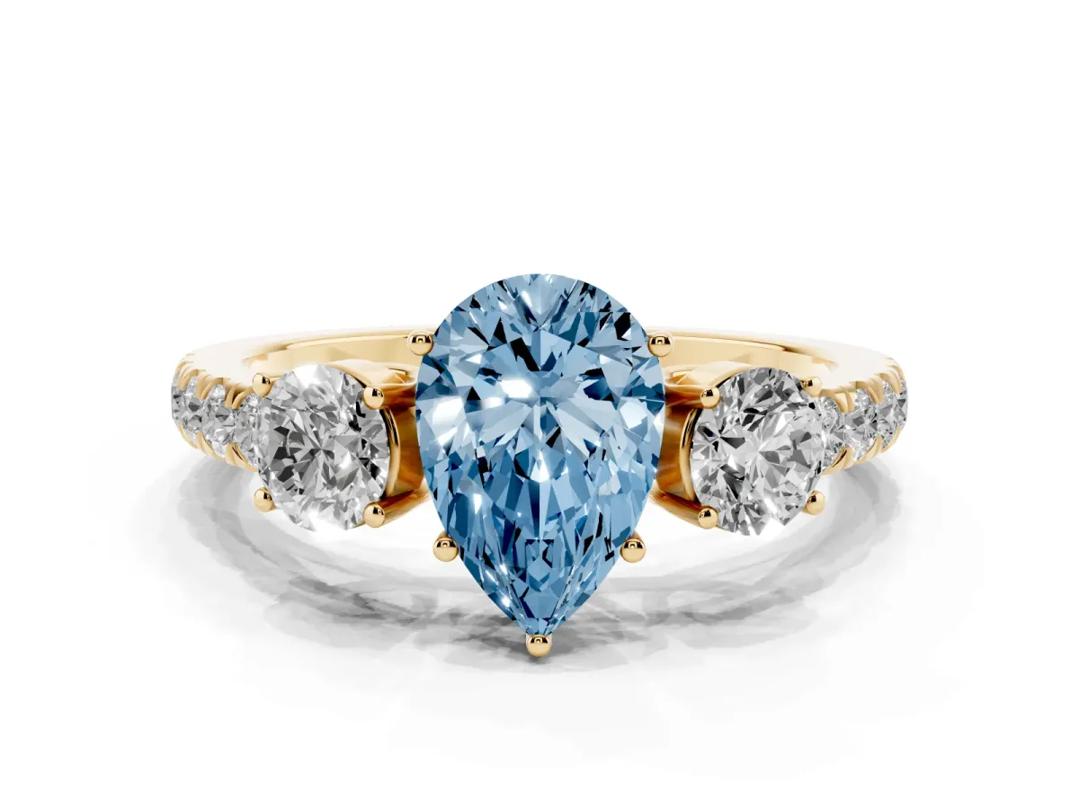 Fancy Blue Pear Cut Cut Diamond Three-Stone Ring with Round Side Stones and Pavé Band Yellow gold