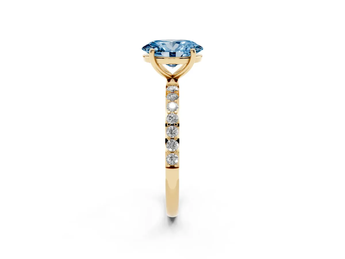 Fancy Blue Oval Cut Diamond Solitaire Ring with Round Pavé Shoulders and Prong Setting Yellow gold